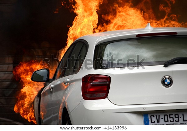 Marseille, France - April 28, 2016 : Car on\
fire during clashes between protesters and french riot police\
during a demonstration against the labor\
law
