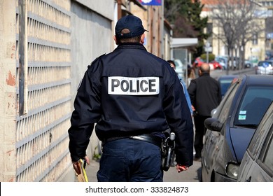 Marseille, France - March 12, 2015 : French Policeman Walking Down The Street.