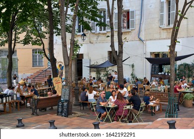 Marseille, France. September 15, 2019: People Sitting On A Terrace Of A Bar In The Monumental Area Of The City.