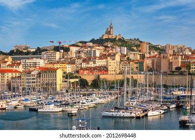 Marseille Old Port (Vieux-Port de Marseille) with yachts and Basilica of Notre-Dame de la Garde. Marseille, France - Powered by Shutterstock