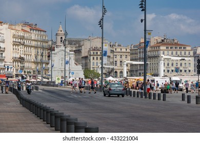 Marseille, Provence/France. July 2015. The Old Port Area Of The City With Shops, Bars And Restaurants Surrounding The Harbor. Unidentified People.