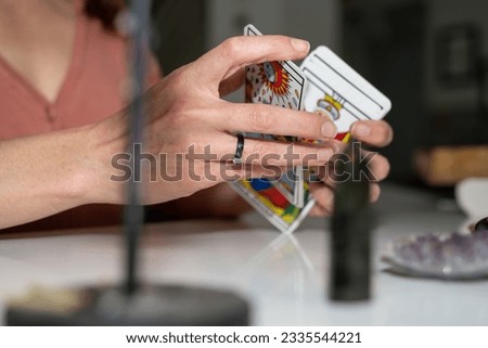 marseille tarot card in the hands of a clairvoyant