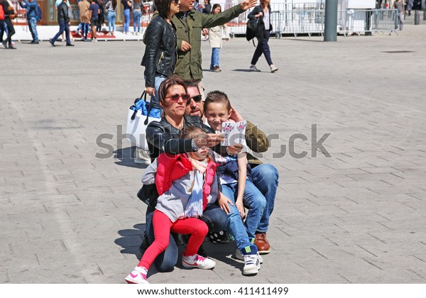 MARSEILLES, FRANCE - APRIL 23, 2016: Unkown family\
taking a mobile photograph. Marseilles is the second largest city\
in France after Paris and the center of the third largest\
metropolitan area 