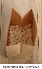 Marshmallow In Brown Craft Paper Bag On Wooden Table, Shallow Focus