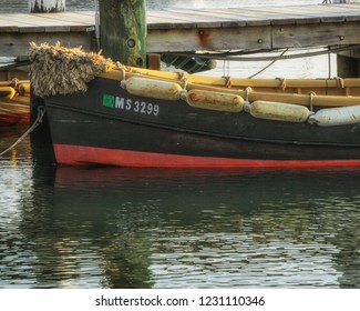 Martha's Vineyard, MA / United States - May 29, 2016: Boat Tied Up To A Dock