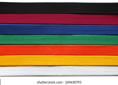 Martial Art belts in seven colors background