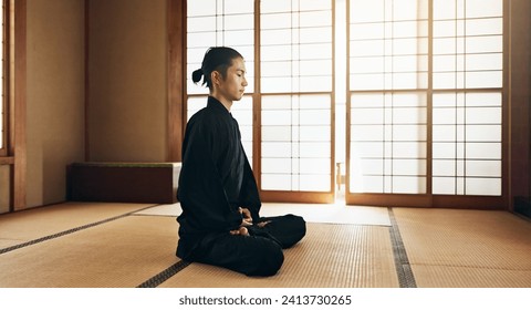 Martial arts man, meditation and exercise in Japanese dojo with mindfulness, zen or chakra balance in morning. Fighter, mma or karate person with peace, breathing and calm for yoga, wellness or floor - Powered by Shutterstock