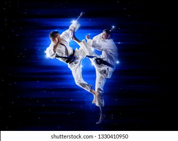 Martial arts masters, karate practice. Dark blue background