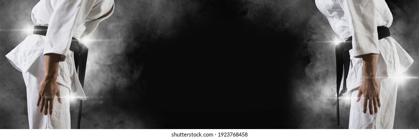 Martial arts masters on dark smoke background. Sports banner
