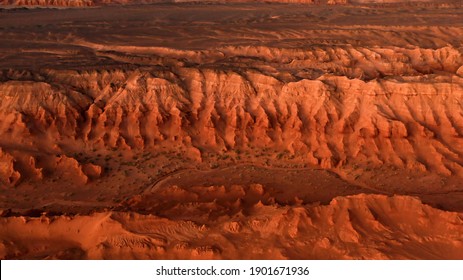 Martian landscape, Flaming Cliffs aerial view in the Gobi Desert. Scorched earth where the remains of dinosaurs rest, and the layings of their eggs. Mongolia. Canyon Herman-Tsav.