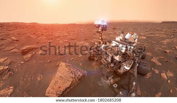 Martian rover Curiosity on surface of red planet\
Mars. Space collage. Sun glow on background. Elements of this image\
furnished by NASA