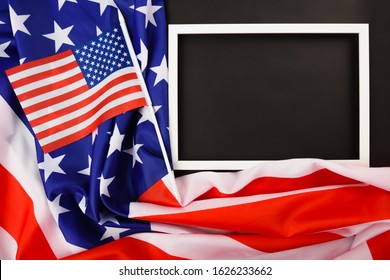 Martin Luther King Day Or USA Independence Day Concept, Flat Lay Top View, American Flag And Photo Frame On Black Background With Copy Space For Your Text