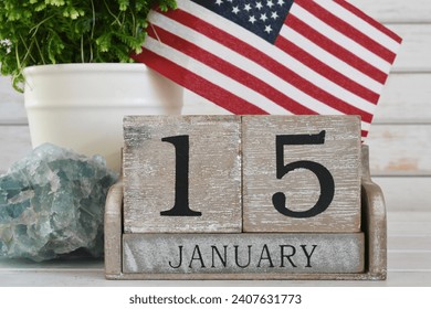 Martin Luther King Jr Day - wooden block calendar showing his birthday January 15 American flag - Powered by Shutterstock