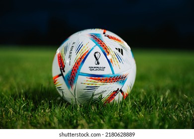 MARTIN, SLOVAKIA, 16 JULY, 2022: Official Adidas Fifa World Cup Football Ball Al Rihla. World Championship In Qatar 2022. Soccer Match Ball On Green Grass In Night At Stadium FIFA 22, Black Edit Space