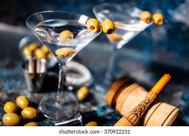 Martini, classic cocktail with olives, vodka and gin served cold in a restaurant