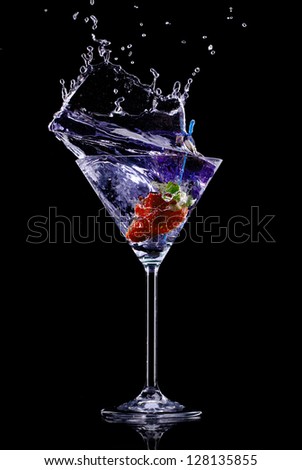 Martini drink over dark background