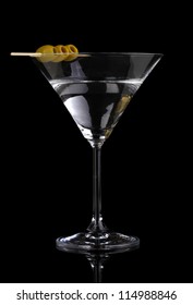 Martini Glass And Olives Isolated On Black