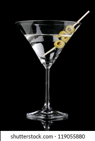 Martini Glass And Olives Isolated On Black