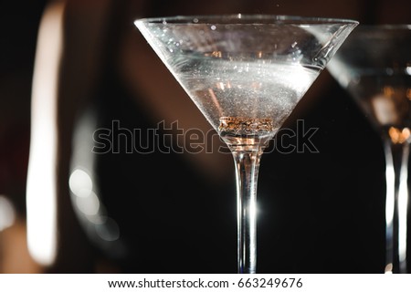 A martini glass with a ring