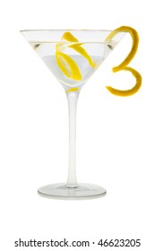Martini mixed drink with lemon peel garnish on a white background