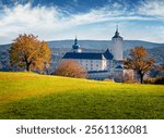 Marvelous autumn view of Forchtenstein Castle, Austria, Europe. Perfect morning scene of apple garden in outskirts  of Forchtenstein town, district of Mattersburg in the Austrian state of Burgenland. 