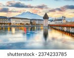 Marvelous historic city center of Lucerne with famous buildings and old wooden Chapel Bridge (Kapellbrucke). Popular travel destination .  Location: Lucerne, Canton of Lucerne, Switzerland, Europe