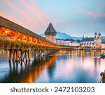 Marvelous historic city center of Lucerne with famous buildings and old wooden Chapel Bridge (Kapellbrucke). Popular travel destination .  Location: Lucerne, Canton of Lucerne, Switzerland, Europe