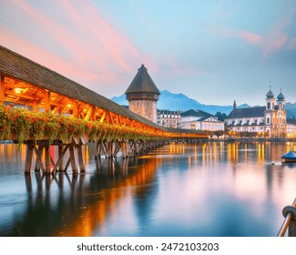 Marvelous historic city center of Lucerne with famous buildings and old wooden Chapel Bridge (Kapellbrucke). Popular travel destination .  Location: Lucerne, Canton of Lucerne, Switzerland, Europe - Powered by Shutterstock