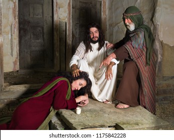Mary of Bethany crying of shame and anointing Jesus' feet, while Judas is protesting against the waste 