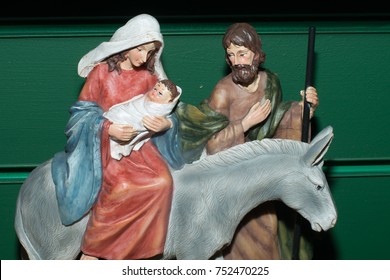 Mary And Joseph With Infant Baby Jesus And Donkey