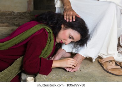 Mary Magdalene crying of shame and embalming Jesus' feet
