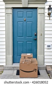 MARYLAND, USA - MAY 24, 2016: Amazon boxes delivered to a residential home. Amazon is the largest internet based retailer in the United States.