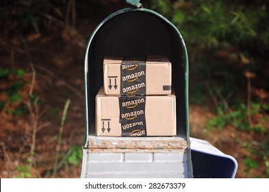 MARYLAND, USA - MAY 29, 2015: Image Of An Amazon Packages. Amazon Is An Online Company And Is The Largest Retailer In The World.