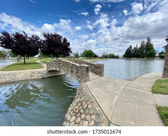 Marysville, CA - May 17, 2020: Ellis Park Lake With Man Made Bridge Crossing To An Island.