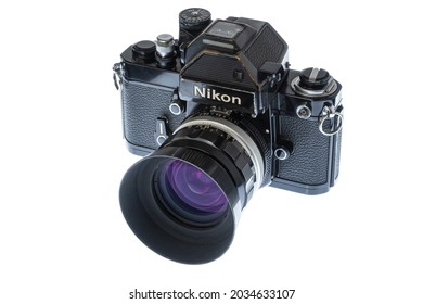 Maryville, Tennessee, United States – August 27, 2021: Horizontal angled front shot of a black Nikon F2S single-lens reflex camera isolated on white.