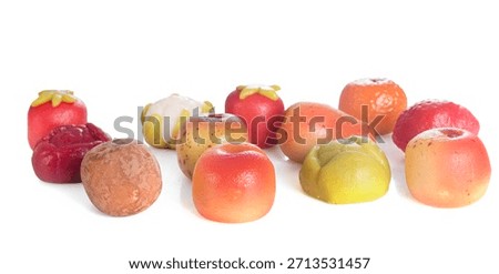 marzipan fruit or vegetable in front of white background