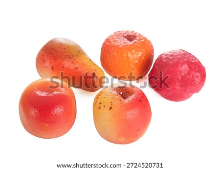 marzipan fruit or vegetable in front of white background
