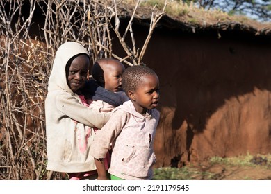 Masai Mara, Kenya - August 4, 2022: Masai People In Loca Village Near Masai Mara National Park.