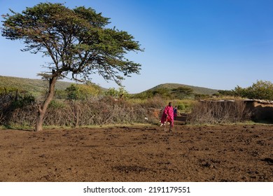 Masai Mara, Kenya - August 4, 2022: Masai People In Loca Village Near Masai Mara National Park.