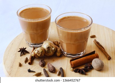 Masala Chai Tea On White Background. Brewed Milk And Tea Leaves With Ginger And Spice. Popular Hot Drink In India And Nepal