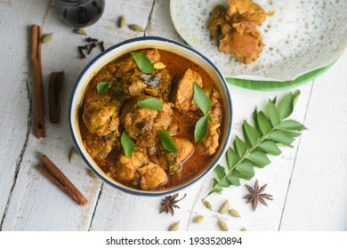 Masala Chicken Curry With Appam Kerala Breakfast , Hoppers Pan Cake , Homemade Chicken Roast Indian Spices , Asian Cuisine Spicy Meat Curry Cooked In Coconut Milk . Side Dish Christian Food Christmas