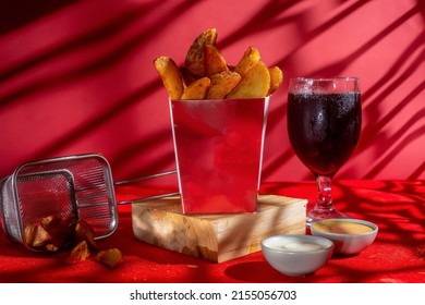 Masala Potato Fries Isolated On Wooden Board With Mayo Dip And Cold Drink Side View