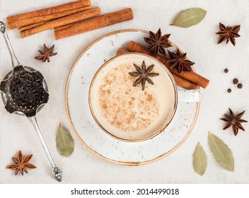 Masala Tea Closeup. Indian Hot Drink With Spices And Milk On A Concrete White Background. View From Above.