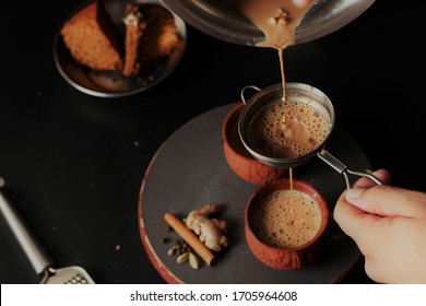 Masala Tea is Popularly known in India as Masala Chai or Herbal tea is under process of Pouring in Earthen cups known as Kulhad. (Masala Chai/Kulhad chai)