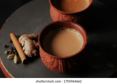 Masala Tea is Popularly known in India as Masala Chai or Herbal tea is under process of Pouring in Earthen cups known as Kulhad. (Masala Chai/Kulhad chai)