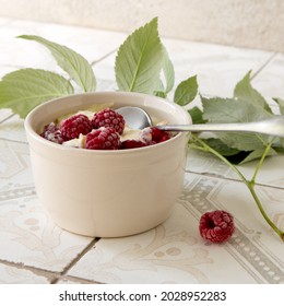 Mascarpone Dessert With Fresh Raspberries On A Light Table