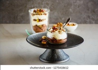 Mascarpone dessert in mason jar with green pistachio nuts - Image