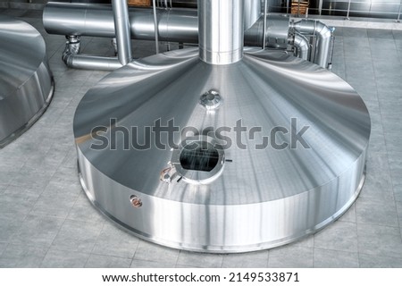 Mash vats of a brewery. Large metal fermentation tanks