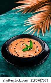 Mashed Lentil Soup, Red Lentil Soup Puree In Black Plate On Table With Copy Space.