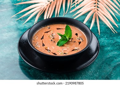 Mashed Lentil Soup, Red Lentil Soup Puree In Black Plate On Table With Copy Space.